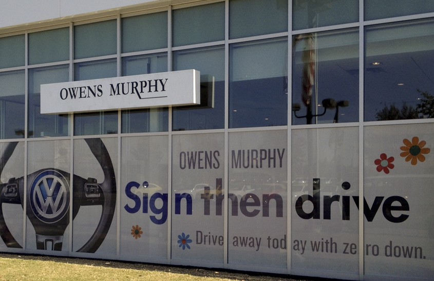 Owens Murphy "Sign then drive" window graphic